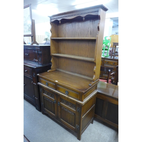 165 - An Old Charm carved oak linenfold dresser