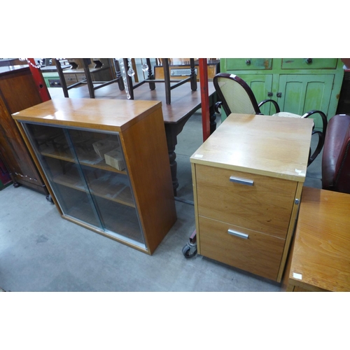 176 - Four teak office cabinets and a table