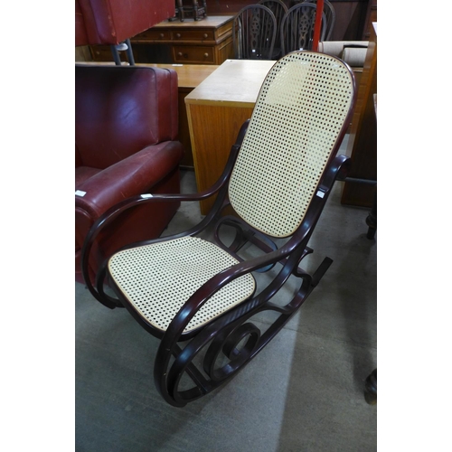 179 - A beech bentwood bergere rocking chair