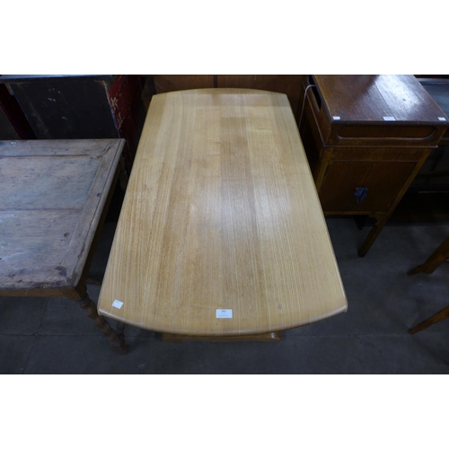 182 - An Ercol ash drop-leaf table