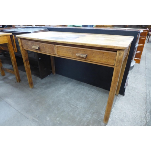 186 - An oak and beech two drawer desk