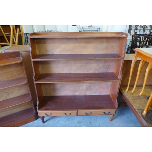 200 - A mahogany waterfall open bookcase and one other