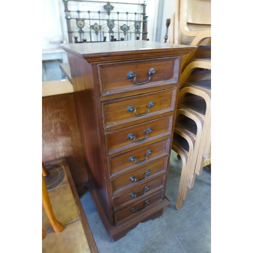 202 - A small French style mahogany semainier chest of drawers