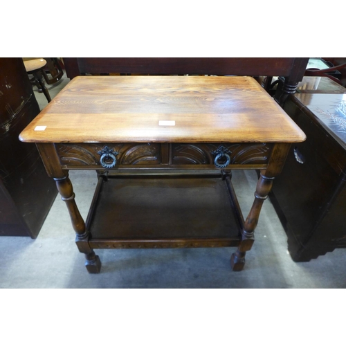 207 - A carved oak side table