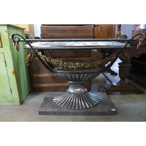 221 - An Italian style steel urn shaped console table, a/f, lacking glass top