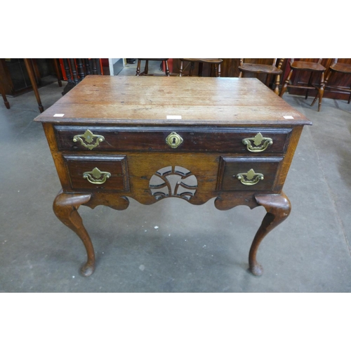 23d - A George II oak lowboy