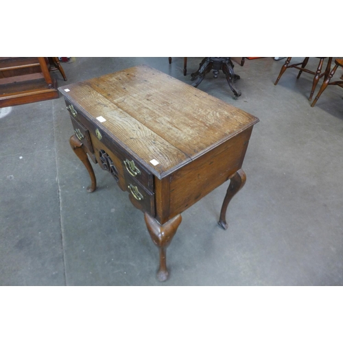 23d - A George II oak lowboy