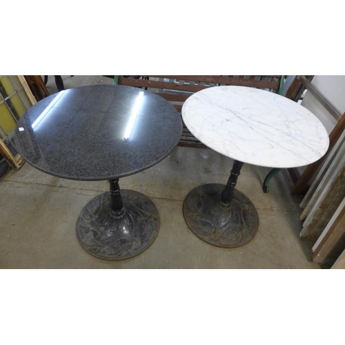 254 - A pair of cast iron and marble topped pub tables