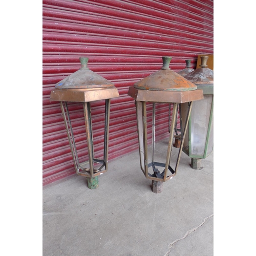 261 - A set of four mid 20 Century bronze and copper lanterns, a/f