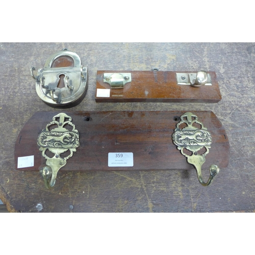 359 - Two vintage coat hooks and a lock shaped key rack