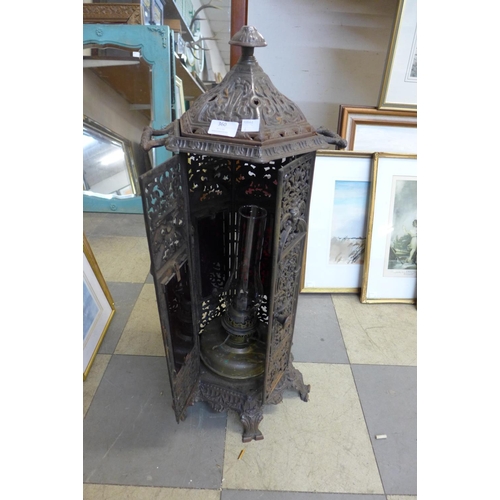 360 - A French style cast iron oil lamp and stand