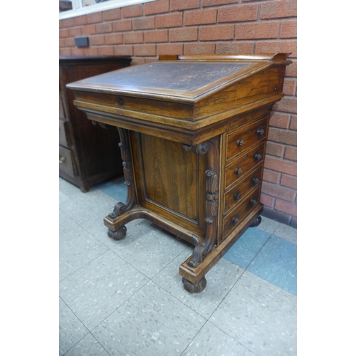 41b - A Victorian rosewood sliding top Davenport, stamped James Winter, 101 Wardour St., London