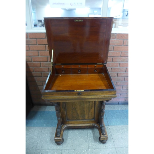 41b - A Victorian rosewood sliding top Davenport, stamped James Winter, 101 Wardour St., London