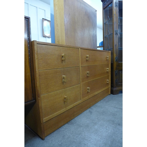 63 - A Stag oak Cantata chest of drawers