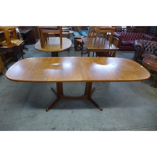 76 - A Danish Gudme Mobelfabrik teak extending dining table, designed by Niels O. Moller