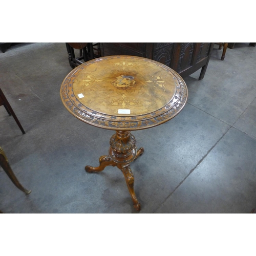 7b - A Victorian carved walnut and marquetry inlaid tripod table