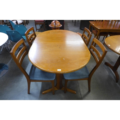 89 - A Nathan teak extending dining table and four chairs