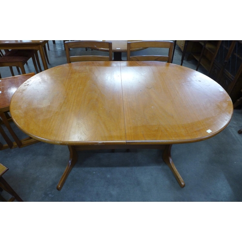 89 - A Nathan teak extending dining table and four chairs