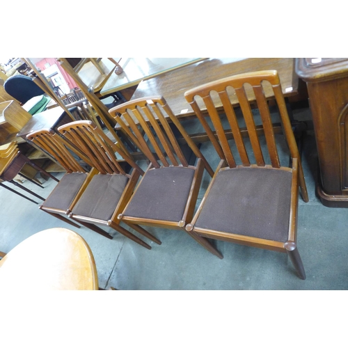 91 - A set of four teak dining chairs