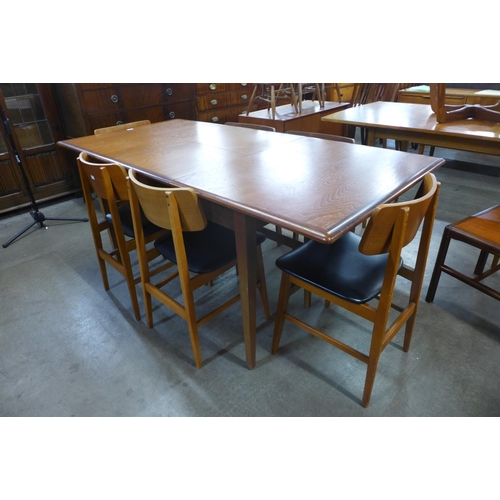 97 - A teak extending dining table and six chairs