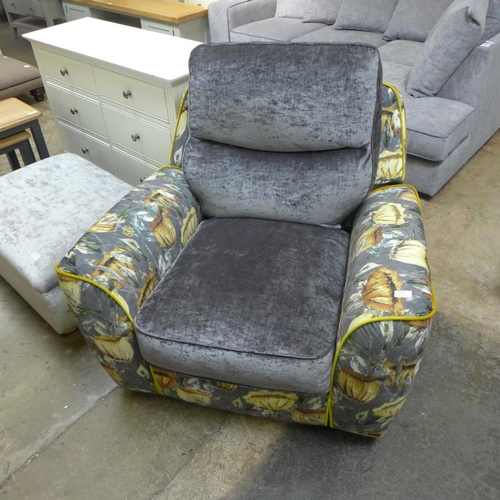 1538 - A grey velvet and floral upholstered recliner chair