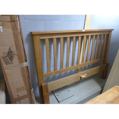 1747 - An oak double bedframe - odd side rails *this lot is subject to VAT