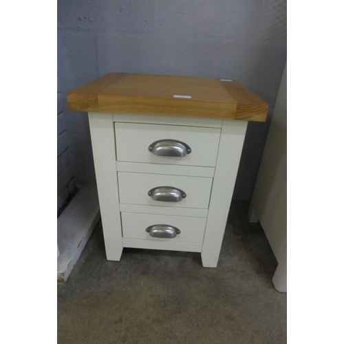 1346 - A Hampshire cream painted oak three drawer bedside table (KEL P03-82)   *This lot is subject to VAT