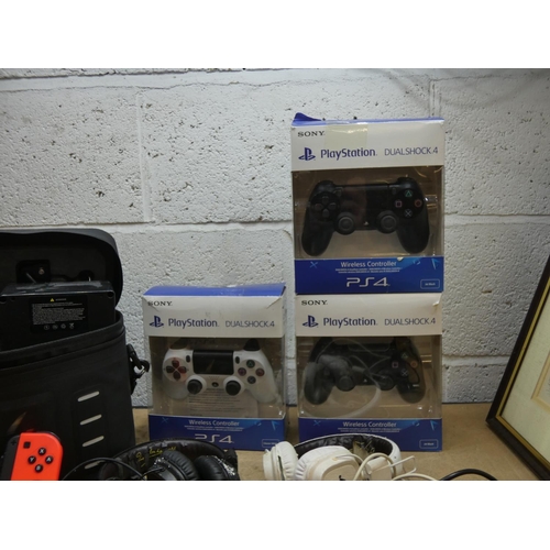 2100 - 3 Playstation PS4 controllers a/f, keyboard, headphones, Switch controllers & battery for a conversi... 