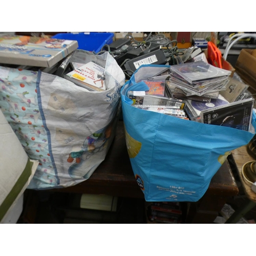 2315 - Samsung DVD player with 2 bags of assorted DVDs and CDs