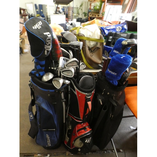 2332 - 3 Golf bags containing various irons, woods & putters inc. Howson, Ping, Ryder, Knife, Covett, etc.