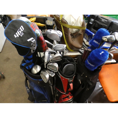2332 - 3 Golf bags containing various irons, woods & putters inc. Howson, Ping, Ryder, Knife, Covett, etc.