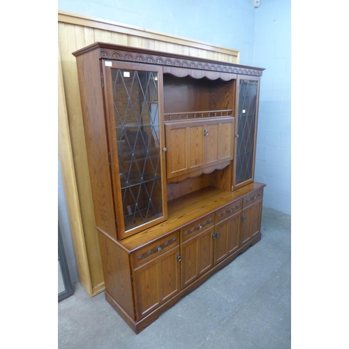 1997 - An oak display cabinet/dresser with glazed leaded lights