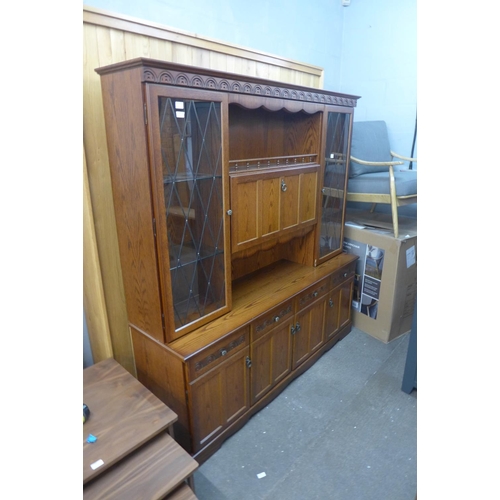 1997 - An oak display cabinet/dresser with glazed leaded lights