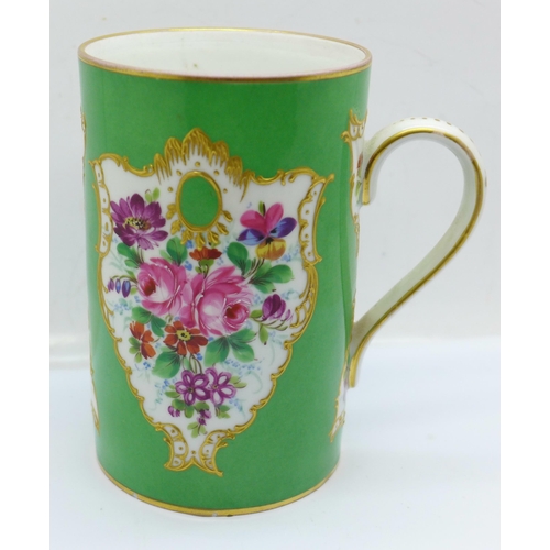 664 - A Dresden hand painted mug decorated with bouquets of flowers