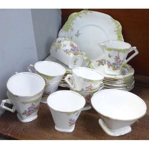 673 - A Standard China tea service, nine cups and saucers, twelve side plates, sugar, cream and a cake pla... 