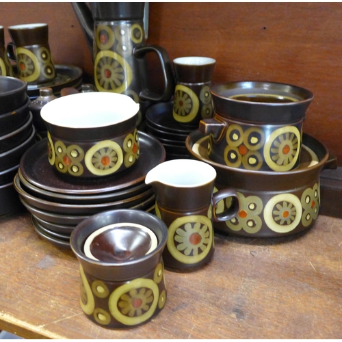 676 - A Denby Arabesque dinner and coffee service including six side plates, six plates, seven mugs and sa... 