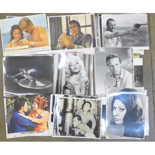 678 - A collection of cinema film lobby cards and photographs, some Star Wars, Star Trek, approximately 15... 