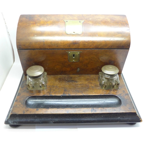 684 - A walnut desk set with glass inkwells and one other desk set