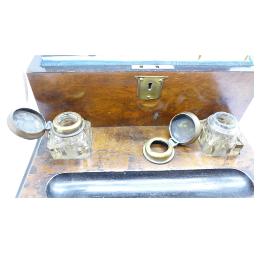 684 - A walnut desk set with glass inkwells and one other desk set