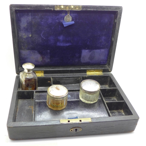 684 - A walnut desk set with glass inkwells and one other desk set