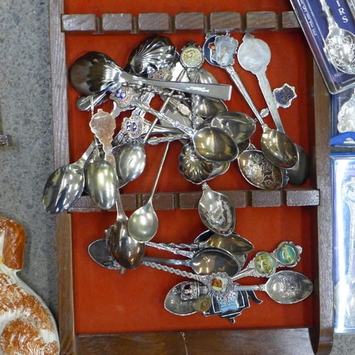 701 - A collection of spoons and thimbles, two display stands, and a pair of Staffordshire spaniels, one a... 