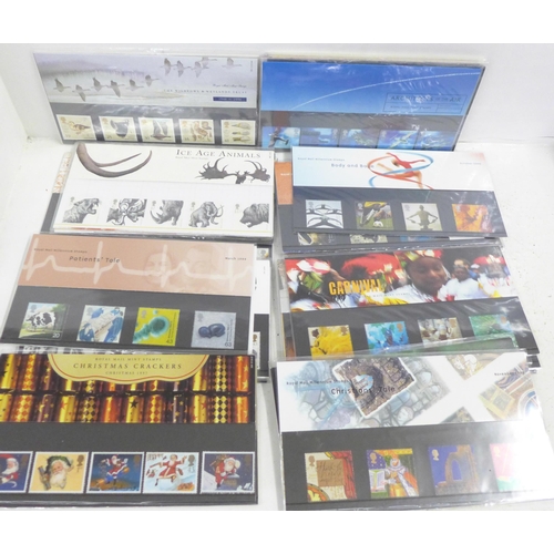 719 - A collection of Royal Mail mint stamp packs, 65+