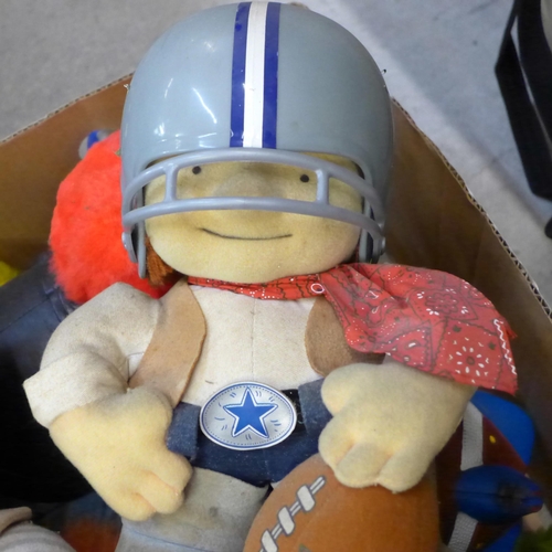 763 - A collection of soft toys, etc., including two NFL toys, a Tyco Rock & Roll Elmo and other U.S. soft... 