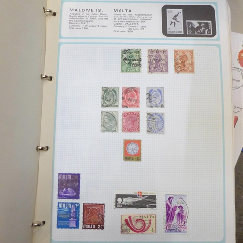 766 - Two albums of world stamps, an album of cigarette cards and first day covers