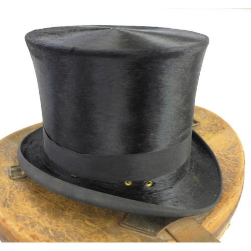 791 - A top hat, marked J. Warsop, Nottingham, in a leather hat box, inner rim requires repair