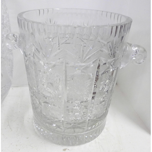 817 - Three lead crystal glass vases, tallest 29cm and a glass champagne bucket