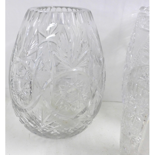 817 - Three lead crystal glass vases, tallest 29cm and a glass champagne bucket