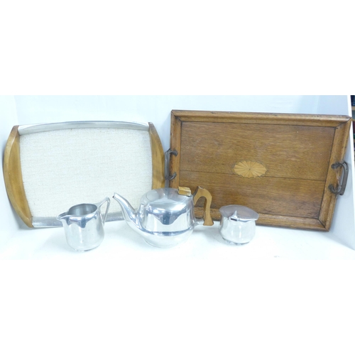 822 - A Picquot ware three piece tea service and tray and one other Edwardian inlaid tray