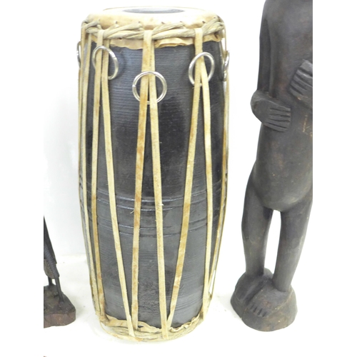 825 - Two carved African figures, a drum and a knife