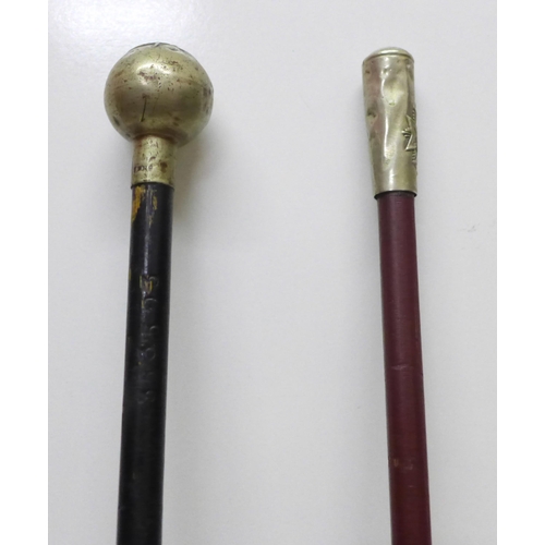 839 - Two military swagger sticks, one Beds & Herts